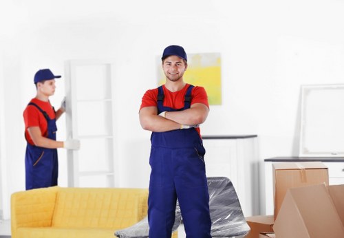 Movers handling household items carefully during a St John’s Wood relocation
