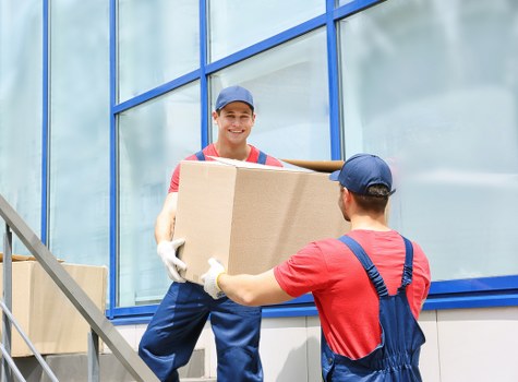 Worker using protective equipment while moving items