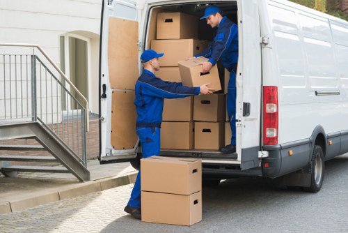 Professional team handling upright piano removals in Stjohnswood