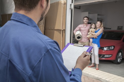 Removal van and moving team preparing a home move in St Johns Wood