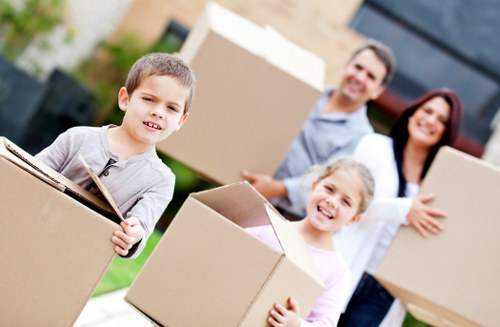 Stjohnswood movers loading packed boxes and furniture into a truck