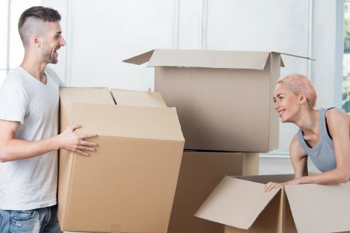 Apartment moving team handling furniture safely during a Stjohnswood relocation