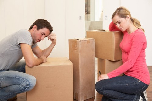 Moving boxes and furniture being loaded into a hire truck