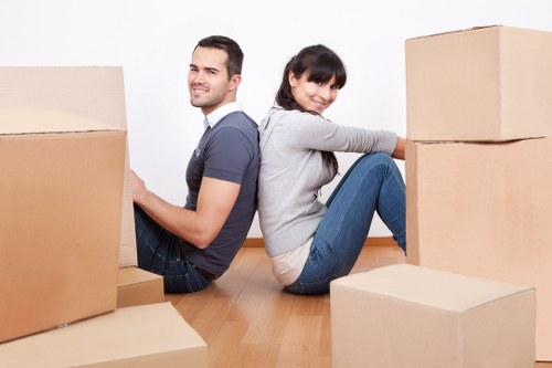 Packing boxes and furniture for a removal van in Stjohnswood