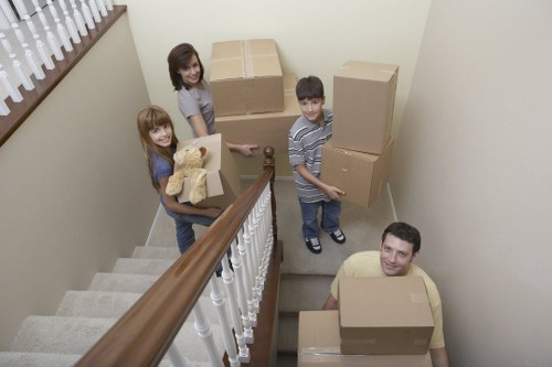 Teams packing office furniture and equipment for relocation